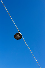old sport field lamp against blue sky