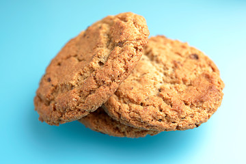 Biscuit. Oatmeal cookies isolated on blue background. Sweet biscuit. Homemade cake.