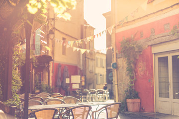 Panoramic view of old town in Europe in beautiful evening light at sunset with retro vintage Instagram style pastel toned grunge filter and lens flare sunlight effect in summer