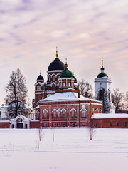 Russian monastery in the winter at sunset