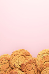 Tasty sugar cookies on pink background. Copy space for text. Top view.