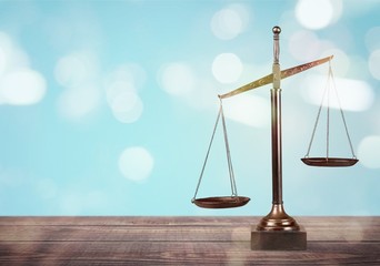 Law scales on table background. Symbol of justice