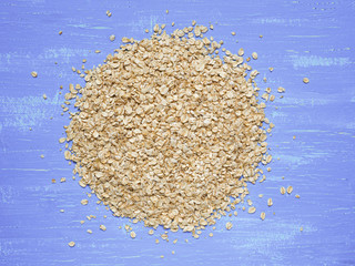 Heap of oat flakes with heart shape