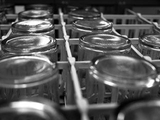 Cafeteria glasses in a dishwasher in black and white