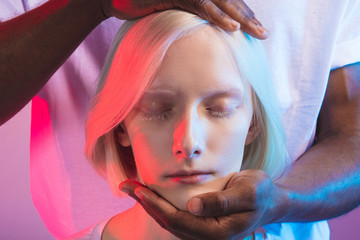 albino girl with white eyelashes getting medical treatment. hypnosis concept. hypnotic girl , close...