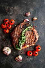 Grilled marbled beef steak with vegetables.Top view with copy space.