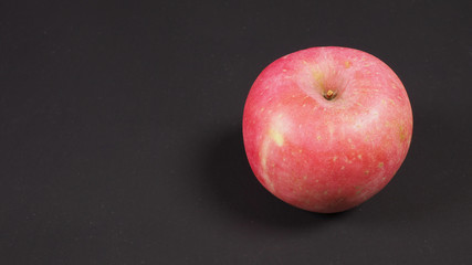 Pink apple or Ambrosia Apple on BLACK background.