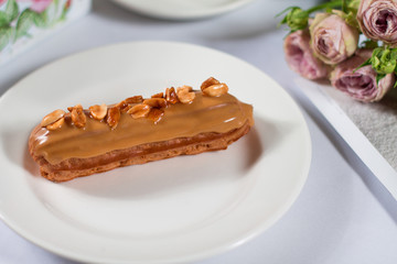 French dessert Eclair on white background