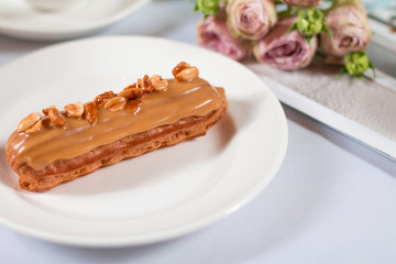 French dessert Eclair on white background
