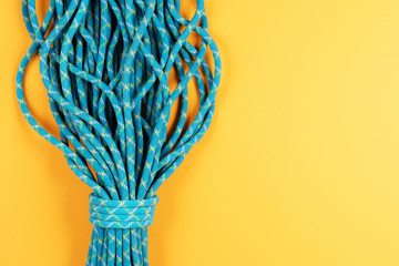 Blue rope on yellow background