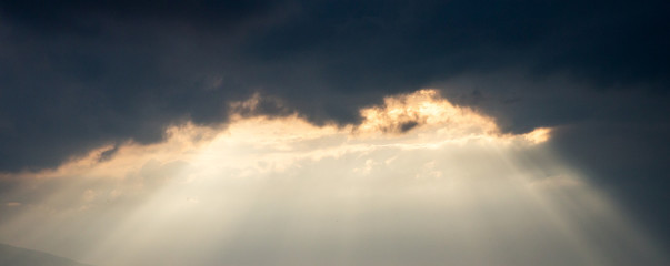 dramatic sky with clouds and sun