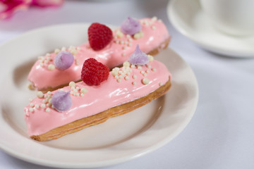 French dessert Eclair on white background
