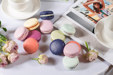French colorful macarons pastel color pasta on a white background