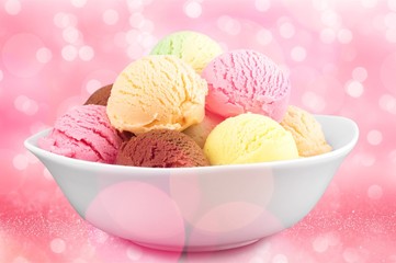 Ice cream scoops in bowl on white background