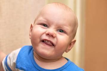 Portrait of a funny boy who grimaces