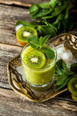 Fresh smoothie cocktail with kiwi fruit, mint and lime.