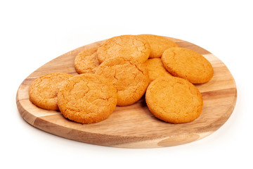 Ginger cookies on a wooden tray, on a white background