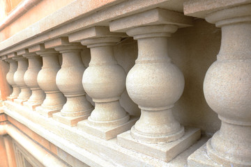 White bannister pillars made of stone. Stone columns