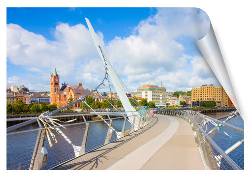 Urban skyline of Derry city, also called Londonderry, in northern Ireland with the famous Peace Bridge (Europe - Northern Ireland) - curl and shadow design concept image