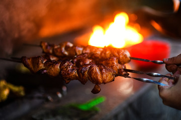 Juicy slices of meat prepare on fire
