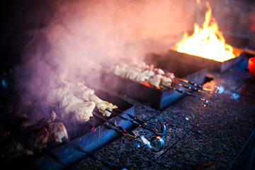 Juicy slices of meat prepare on fire