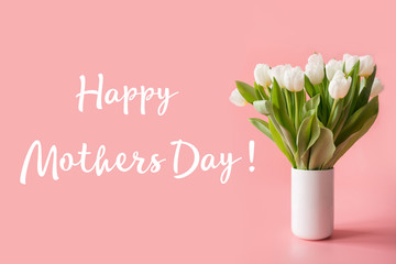 May mothers day card. Border of white tulip on pastel millennial pink. Text - Happy Mothers day.