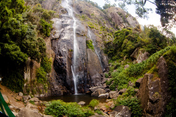 The waterfall. The waterfall with the mountains in the country of Sri Lanka