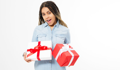 Fototapeta premium Happy young woman holding red and white gift boxes isolated - The concept of holidays and discounts in stores .