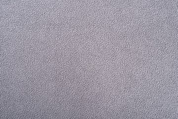 Fototapeta na wymiar grey fluffy fabric as background and texture