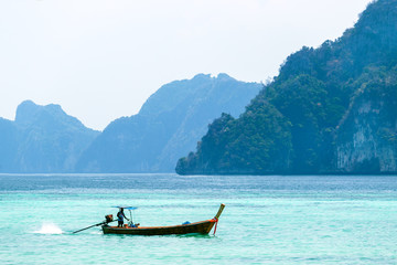 Beautiful landscape with traditional boat on the sea in Phi Phi region, Thailand. Travel, holiday in the Asia.