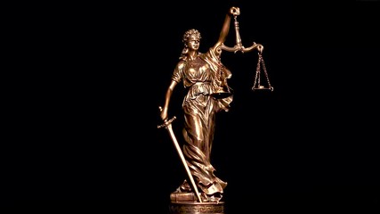Themis statue with a scale. Law.