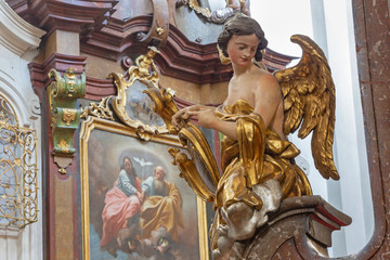 PRAGUE, CZECH REPUBLIC - OCTOBER 12, 2018: The carved polychrome baroque statue of angel from the side altar in St. Francis of Assisi church by  M. V. Jäckel a J. K. Liška. (17. - 18. cent.).