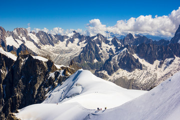 Chamonix, south-east France, Auvergne-Rhône-Alpes. Climbers heading for Mont Blanc.Panorama of the snowy mountains which climbers climb