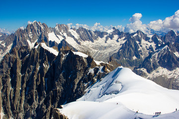 Chamonix, south-east France, Auvergne-Rhône-Alpes. Climbers heading for Mont Blanc.Panorama of the snowy mountains which climbers climb
