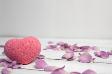 organic cosmetic with rose oil on white wood background