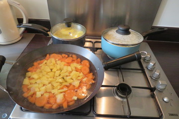 pans of fesh vegetables boiling for a healthy meal