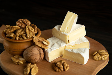 Cheese camembert or brie with walnut kernels