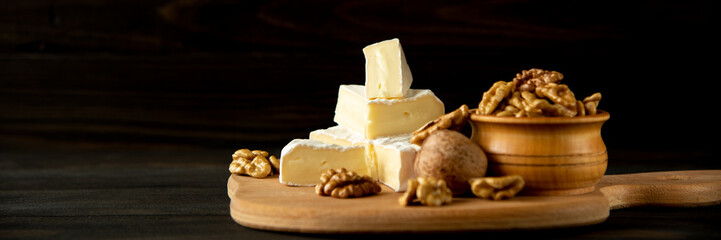 Cheese camembert or brie with walnut kernels