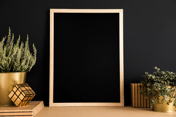 Photo frame mock up and a plant.