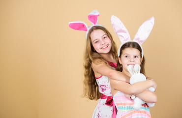 Happy easter. Holiday bunny girls with long bunny ears. Children bunny costume. Playful girls sisters celebrate easter. Spring holiday. Happy childhood. Easter day. Easter activities for children