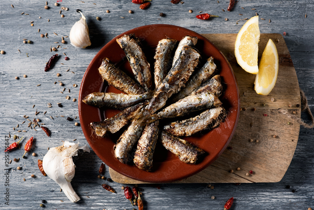 Poster spanish grilled sardines in a plate