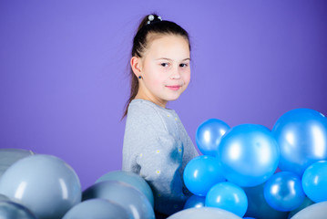 Fototapeta na wymiar Carefree childhood. All those balloons for me. Happiness positive emotions. Obsessed with air balloons. Having fun. Balloons theme party. Girl between air balloons. Birthday party. Childrens day