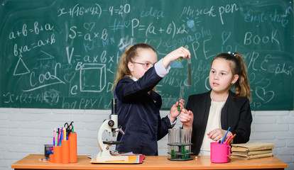 Little girls scientist work with microscope. Little girls in school lab. Science is future. science experiments. Chemistry research. Biology science. Happy little girls. Developing new approaches