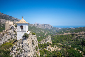 Fototapeta na wymiar The famous Bell Tower and Gateway at Guadalest. Alicante, Comunidad Valenciana, Spain.