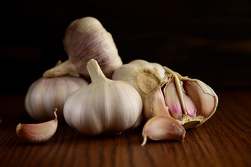 Garlic bulb on the wooden vintage background