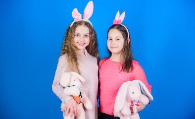 celebrate spring. Happy easter. Egg hunt. Family and sisterhood. Little girls with hare toy. Spring holiday party. Children in rabbit bunny ears. Ready to celebrate. With friends. Spring mood