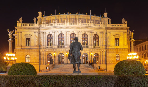Building of Rudolfinum with statue of composer Antonin Dvorak from back. Night shot. Famous concert hall and home of the Czech Philharmonic, Prague, Czech Republic