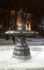 Old inoperative fountain at winter.