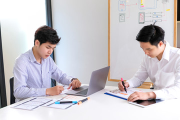 Young man designers planning work together on website ux app development.