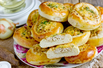 Homemade dinner buns stuffed with minced meat and cheese. Round meat patties from yeast dough for snack. Cheese meat pizza pies